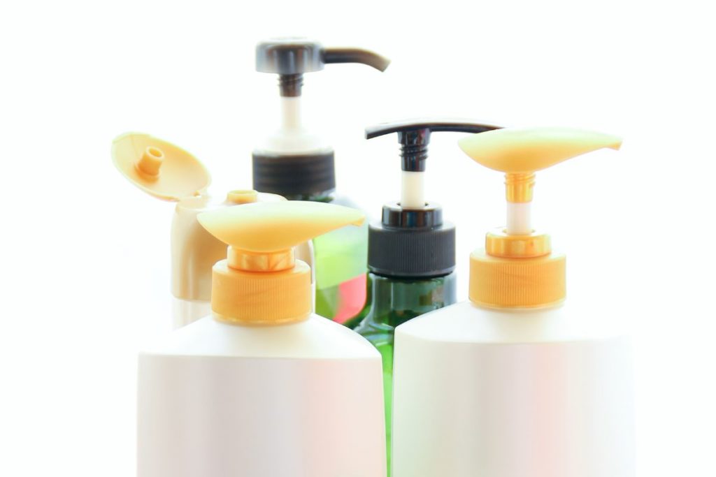 a photo of several shampoo bottles to show the best shampoos for american bullies